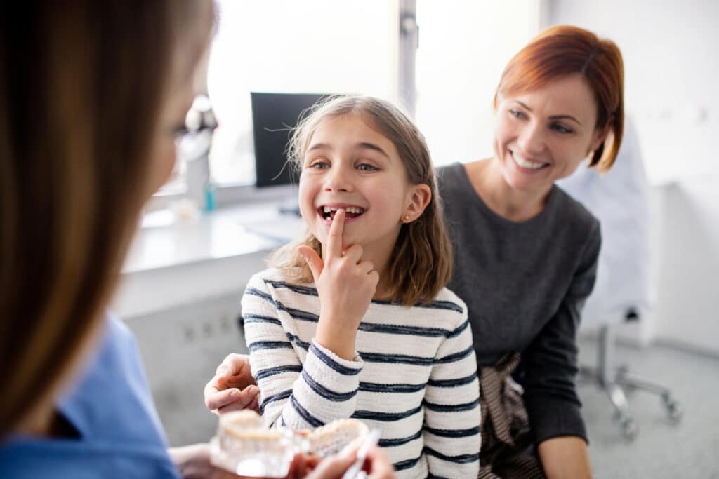 Dentist speaking with a family