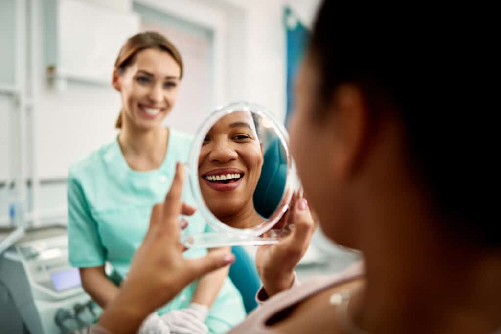 Patient visiting the dentist and viewing their smile