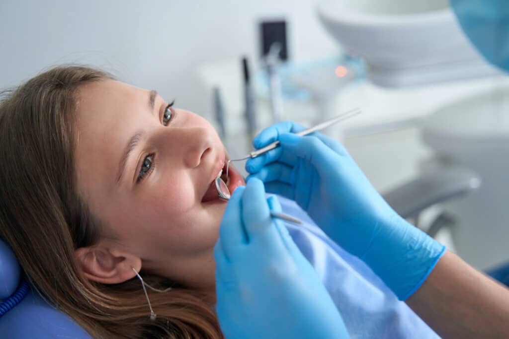 Pediatric patient being examined at the dentist