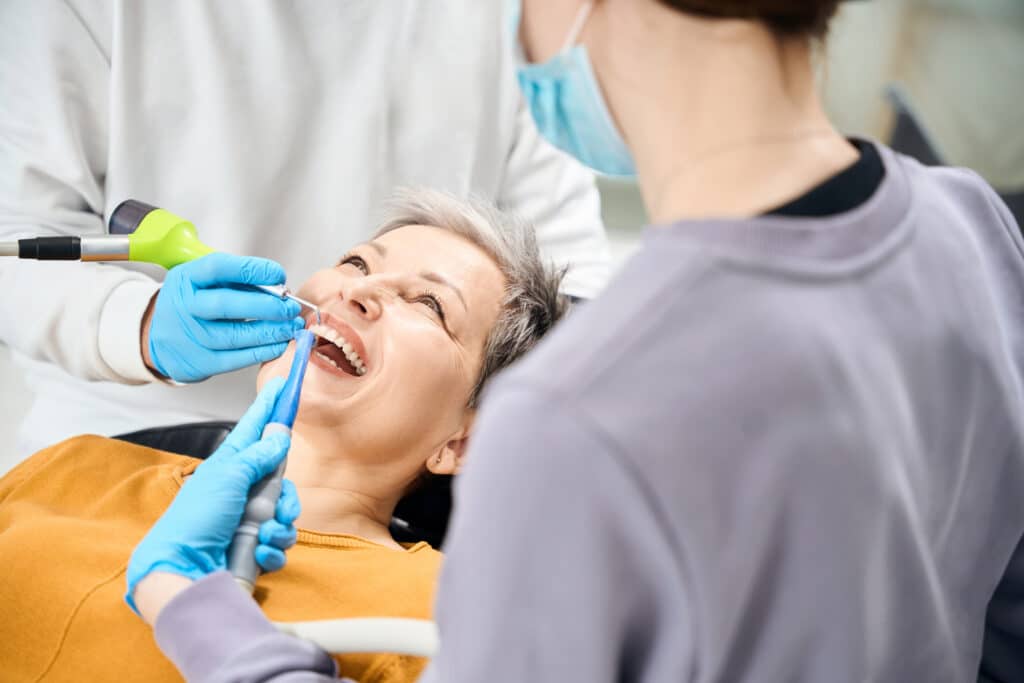 Patient receiving a deep tooth cleaning