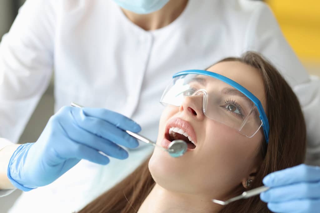 Dentist examining a patient's oral cavity