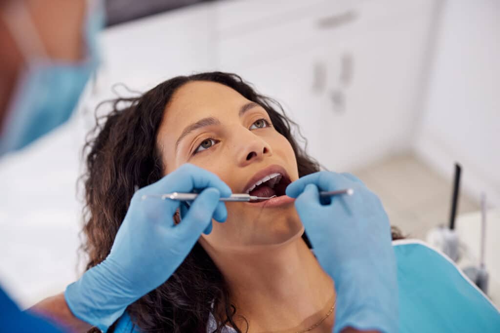 Dental patient undergoing a dental procedure in the chair