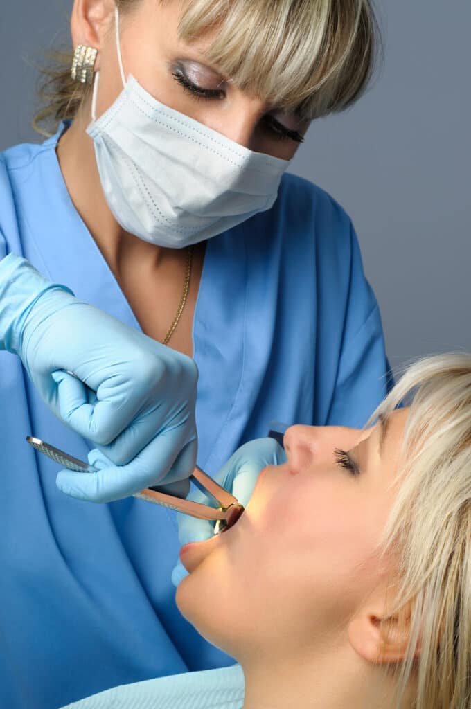patient receiving a tooth extraction