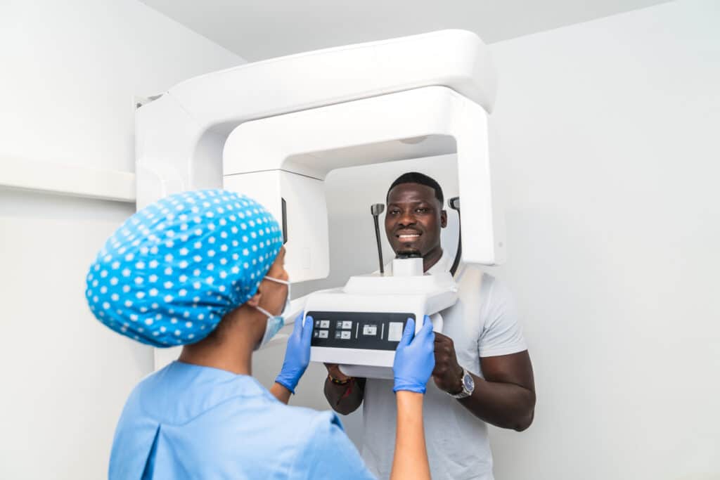 Patient is receiving 3D imaging for his dental checkup