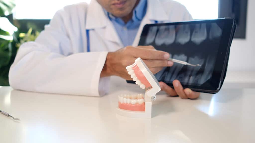 dentist showing a patient their x-rays